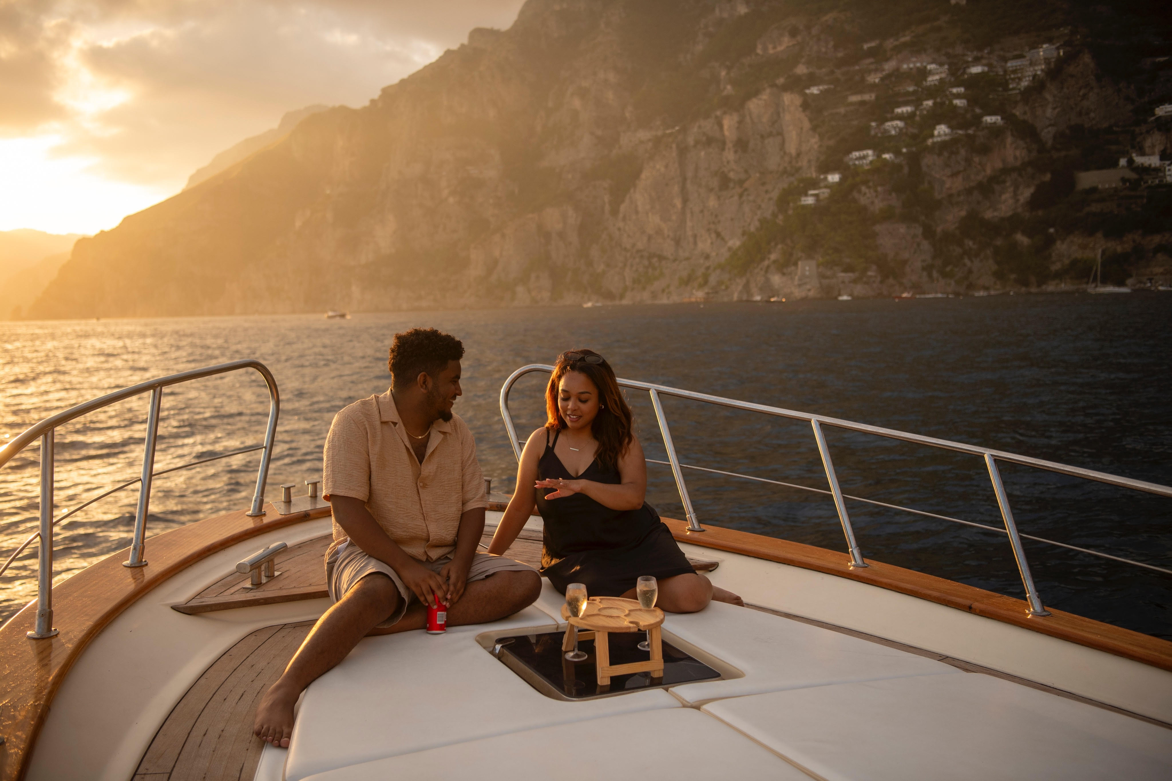 Mahlet and Michael enjoying a romantic sunset on their yacht with champagne